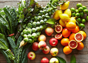 a group of fruits and vegetables on a wood surface Healthy Weight Loss Diets Burton upon Trent