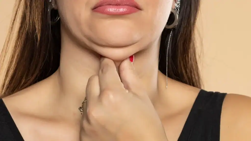 An image of a woman with double chin, sad, worried : Non Surgical Double Chin Removal Treatment in Burton upon Trent, UK